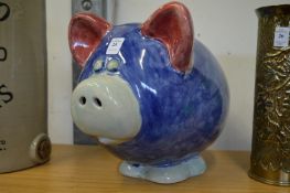 A large pottery piggy bank.