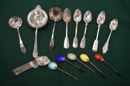A small group of silver flatware.