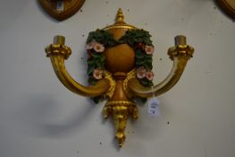 A good pair of carved gilded and painted twin branch wall appliques.