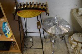 A decorative mirrored tripod table, a stool and a fire grate fender.