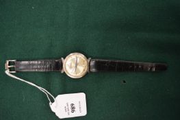 An early Bulova Accutron stainless steel wristwatch with original leather strap.