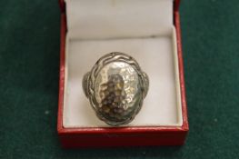 A silver dress ring.