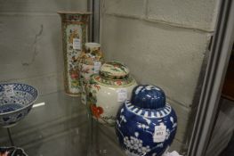 Two Chinese ginger jars and covers and two vases (faults).