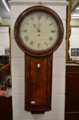 A large 19th century mahogany wall clock with white painted circular dial.