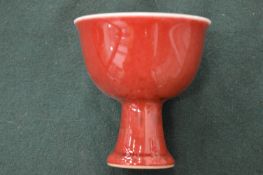 A small blanc de chine pedestal cup.