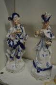 A pair of Continental porcelain figures.