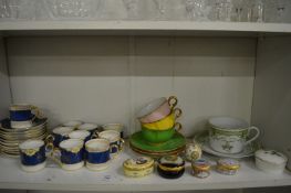 A quantity of coffee cans and saucers, Halcyon Days enamel boxes etc.