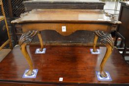 A small walnut coffee table.