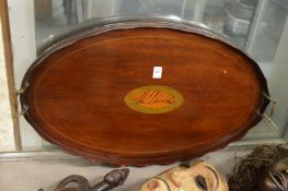 A shell inlaid mahogany oval twin handled tray.