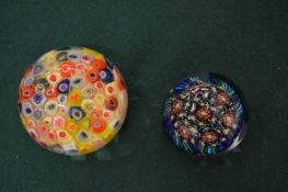 Two glass paperweights.