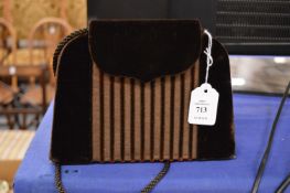 A Pellegrino brown suede handbag.