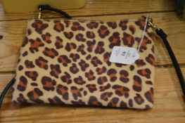 Three ladies handbags.