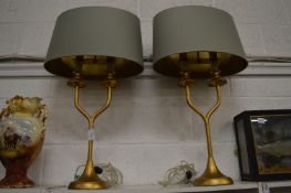 A pair of stylish twin branch table lamps.