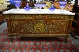 A very large and impressive mahogany, ormolu and marble top commode.