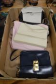 A quantity of ladies handbags.
