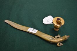 A lizard shaped letter opener and a bottle stopper mounted with a bunny rabbit and cabochon