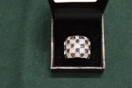 A silver dress ring.