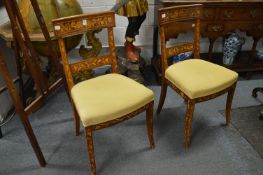 A set of four 19th century mahogany and marquetry dining chairs, possibly Dutch.