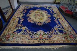 A Chinese carpet, blue ground with floral decoration, 380cm x 280cm.