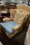 A Georgian style wing armchair.