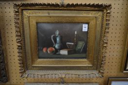Still life study of a pewter flagon, candlestick, books and apples on a table, oil on board together