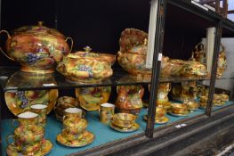 A large quantity of fruit decorated dinner ware and other similar items.