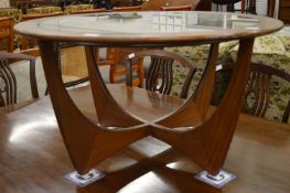 A G plan astro table inset with an Eastern brass charger.