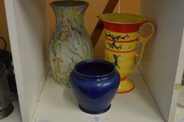 Three decorative vases and jugs.
