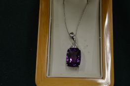 A good amethyst and diamond pendant on a fine 14ct white gold chain.