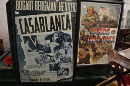A reproduction poster for the film Casablanca and another for the film Sands Of Iwo Jima, both
