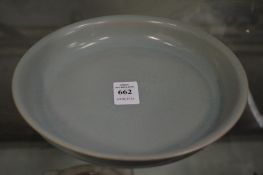 A Chinese circular celadon glazed dish.