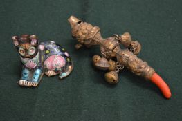Babies rattle with coral teething ring and Chinese model of a cat.