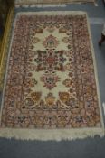 A Persian style cream ground rug, 160cm x 103cm.