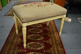 A French style upholstered foot stool.