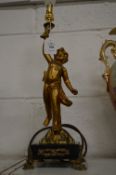 A figural table lamp.