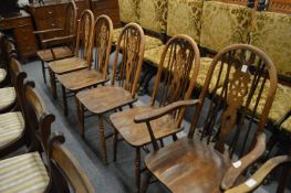 A set of six Olde Charm wheel back dining chairs, two with arms.