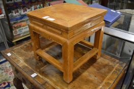 A pair of small Chinese stands.