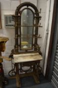 A cast iron and marble top hall stand.