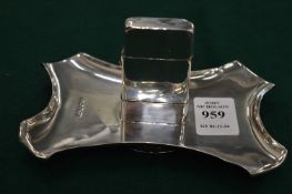 An interesting silver combination lighter and ashtray.