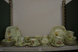 A quantity of Royal Worcester tea ware, pale green ground with floral decoration.