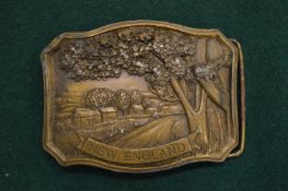 A cast metal belt buckle.