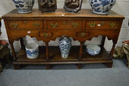 A good 18th century oak dresser with three frieze drawers, two further small drawers and a pot board