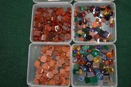 Four boxes of coloured stones.