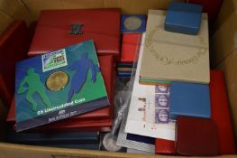 A quantity of coin sets and other collectors coins.