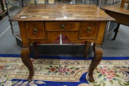 An 18th century walnut lowboy (faults).