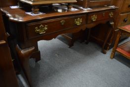 A mahogany two drawer side table.