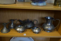 A Tudric pewter four piece tea service, pattern no: 01324, water jug lacking cover, together with