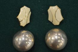 A pair of Monet earrings and another pair of earrings.