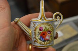 A Chamberlains Worcester floral decorated miniature watering can (lid chipped) together with other