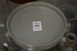 A Chinese celadon glazed brush washer on three small feet.